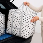 Star Printed Quilt Storage Bag – Large Capacity Clothes & Blanket Organizer Keep your home clean and organized with this premium quality Star Printed Quilt Storage Bag. Made from durable non-woven fabric, this large capacity organizer is perfect for storing quilts, blankets, pillows, clothes, and other seasonal items while protecting them from dust and dirt. Key Features Large storage capacity for quilts, blankets & clothes Premium quality non-woven fabric Stylish black & white star printed design Dustproof and water-resistant storage solution Foldable and space-saving design Suitable for wardrobe, closet & under-bed storage Size 48 × 48 × 42 cm Specifications Feature Details Product Type Quilt & Clothes Storage Bag Material Non-Woven Fabric Storage Feature Water Resistant Design Star Printed Use Blanket, Quilt & Clothing Storage Brand No Brand Frequently Asked Questions Q: What can I store in this bag? A: You can store quilts, blankets, pillows, clothes, bedsheets, and seasonal items. Q: Is the bag foldable? A: Yes, it can be folded easily when not in use. Q: Does it protect from dust? A: Yes, the bag is designed to protect items from dust and dirt. SEO Title Star Printed Quilt Storage Bag – Large Capacity Blanket & Clothes Organizer